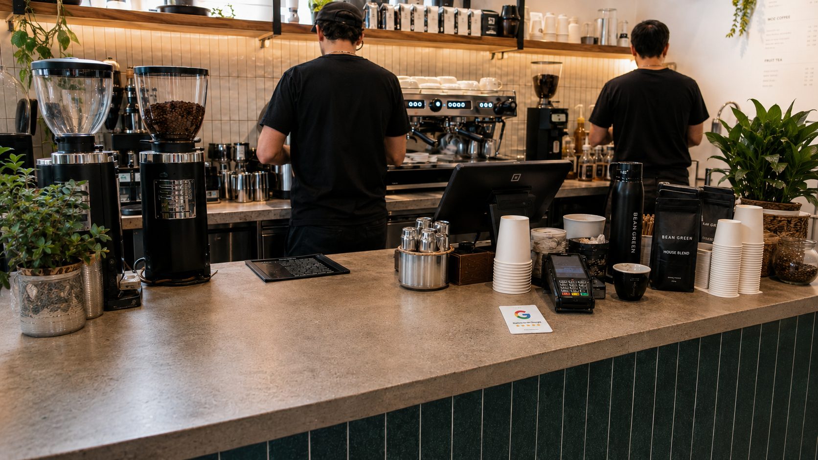 An NFC review card standing beside the till on a cafe counter